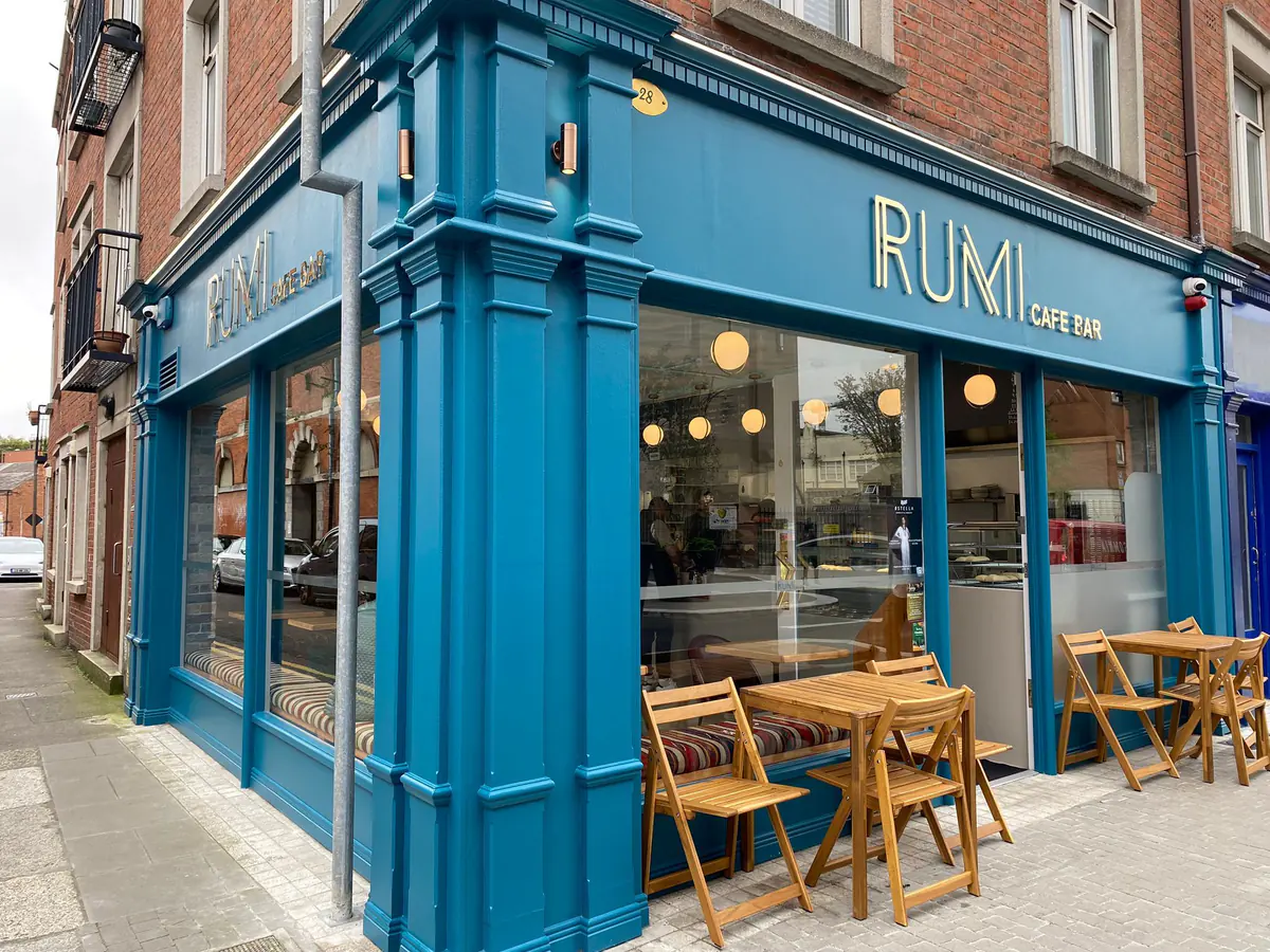 The teal Rumi Cafe Bar storefront on Francis Street